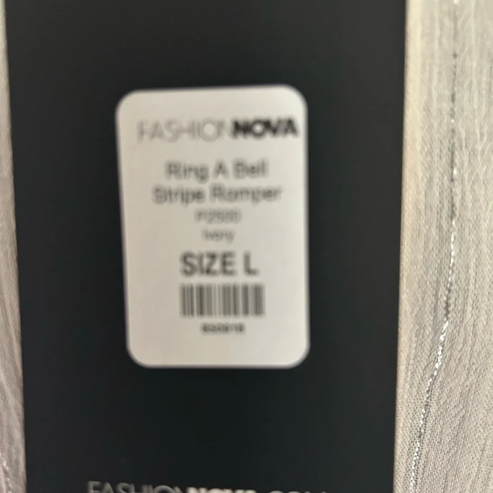 Fashion Nova cream with silver stripes short set zip up back. Plunging neckline.